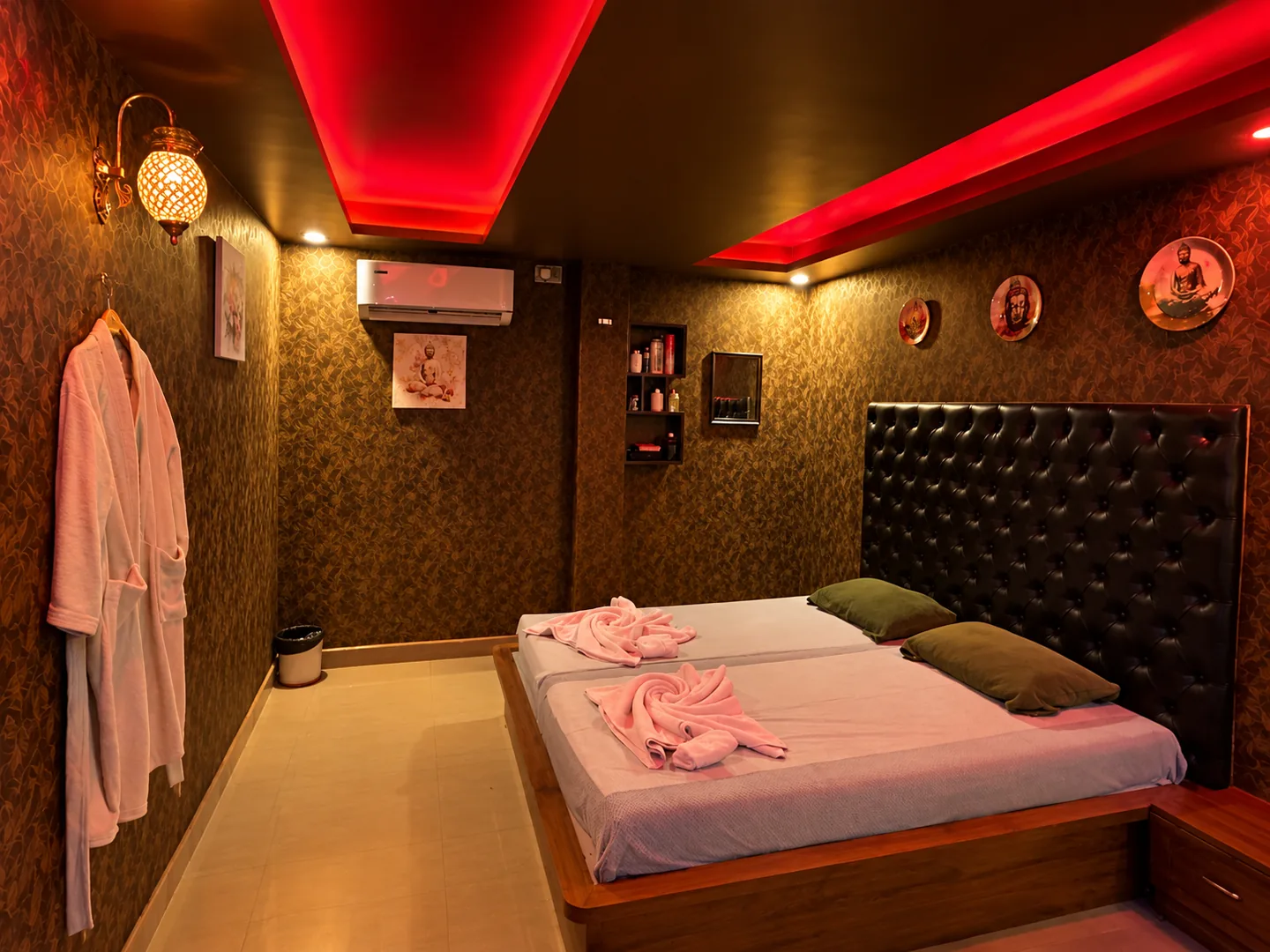 Private couple treatment room with warm red ceiling lighting